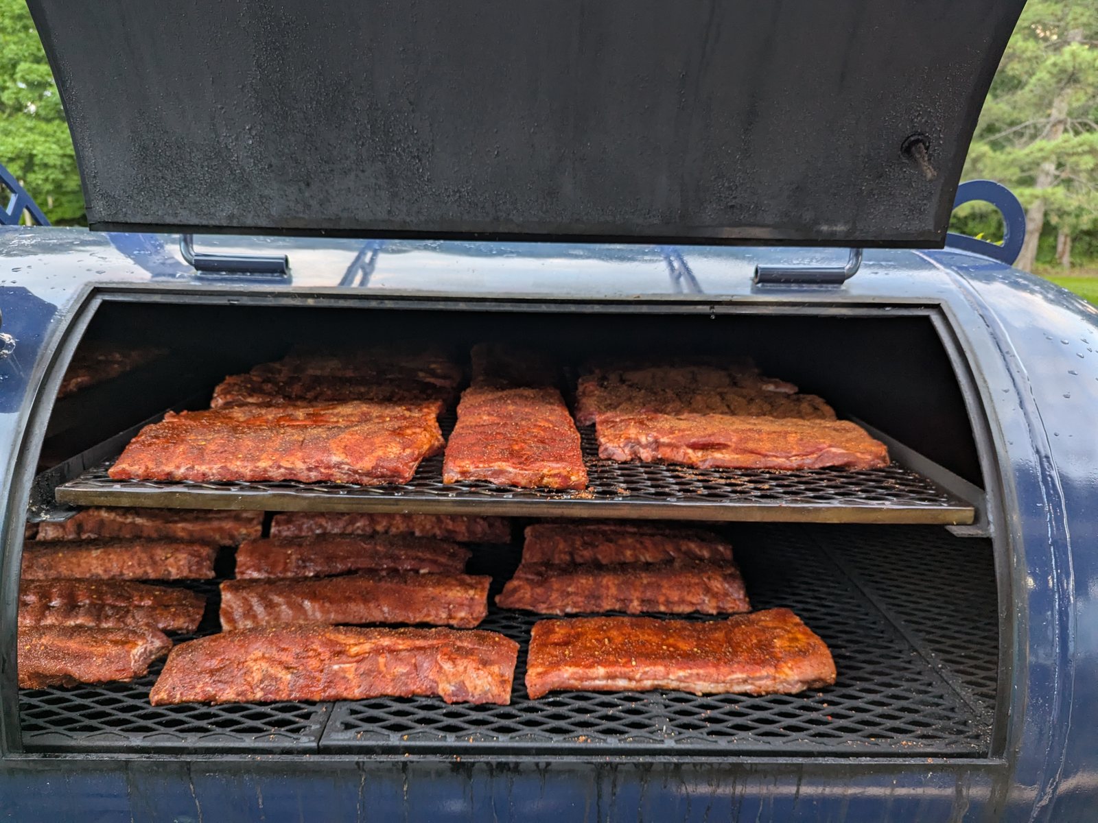 Fifty-seven slabs of spare ribs on the Primitive Pits 500-gallon offset smoker
